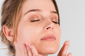 woman touching her face