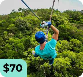 Person ziplining over a dense green forest, wearing a blue helmet and teal shirt, secured in a harness with ropes, with a $70 promotional tag in the bottom-left corner.